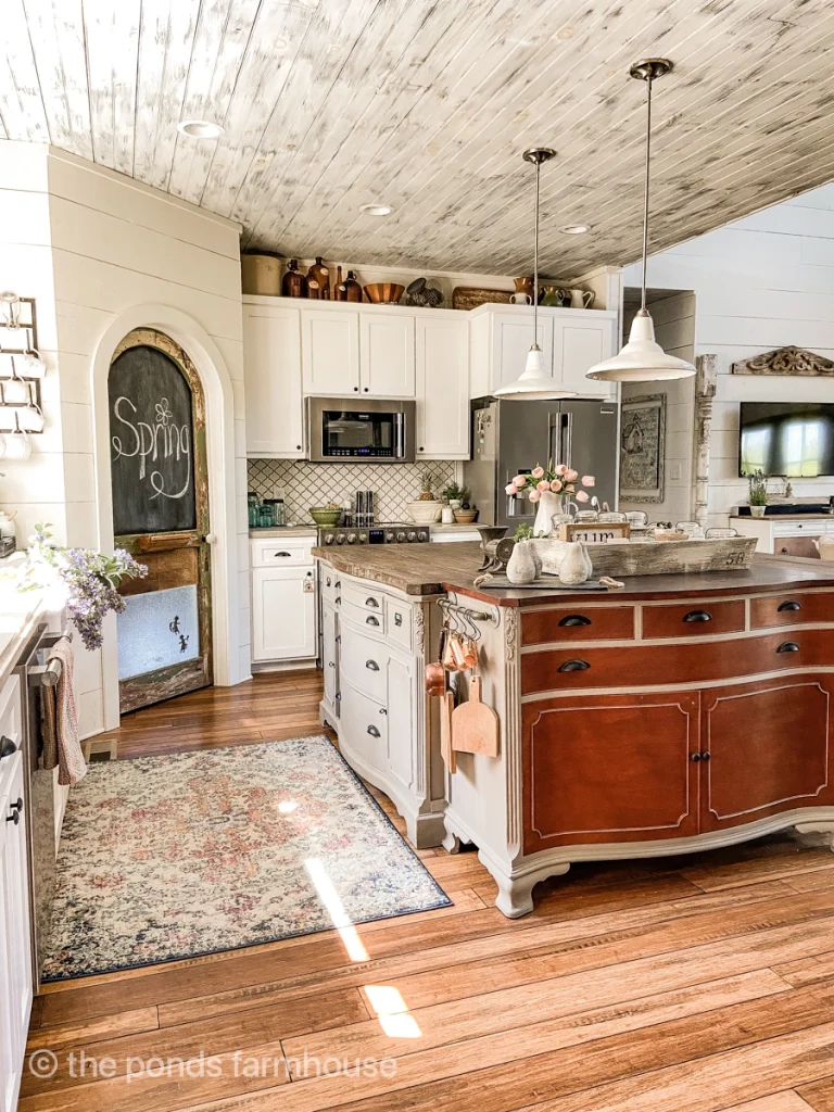 farmhouse decor ideas in vintage style kitchen with large kitchen island made from repurposed dressers