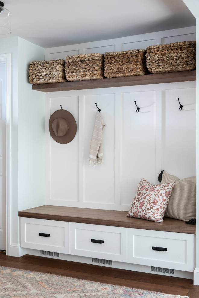 Modern rustic entry with long ledge holding storage baskets 