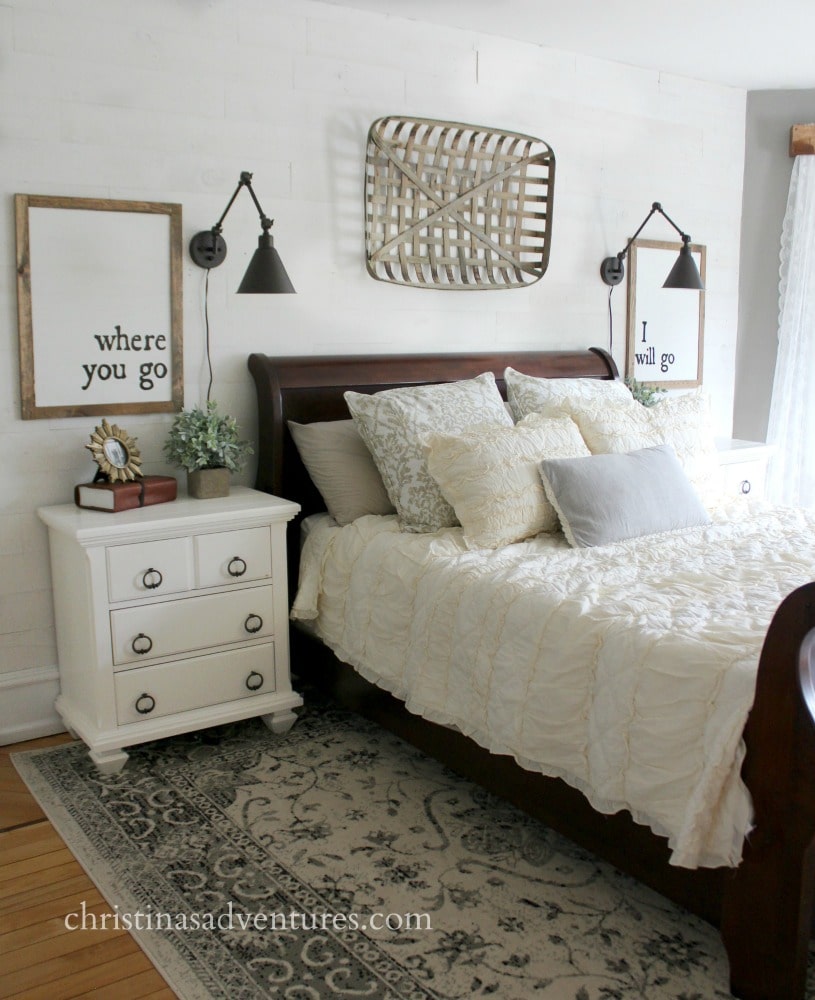 Farmhouse bedroom with wall mounted lamps