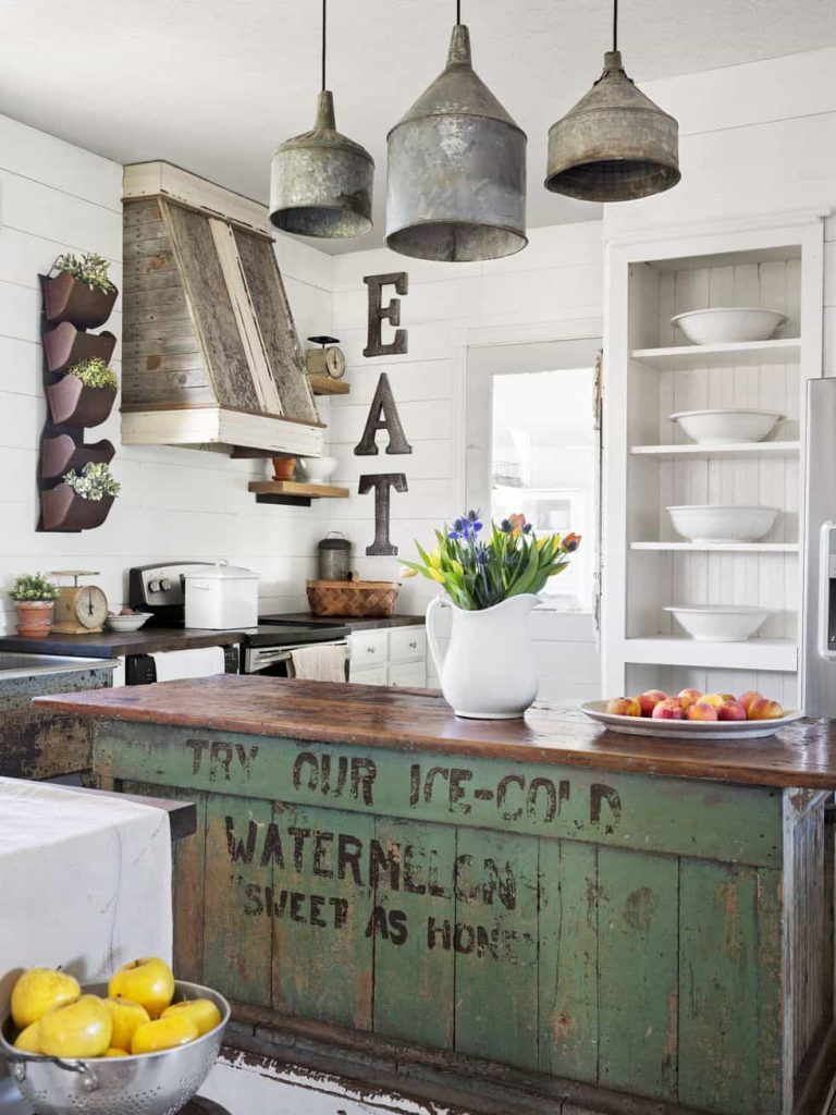 vintage farmhouse kitchen furnished with repurposed items and galvanized farm funnel light fixtures