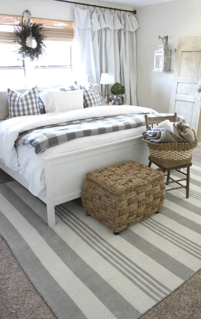 Farmhouse style bedroom wtih white and gray tones. 