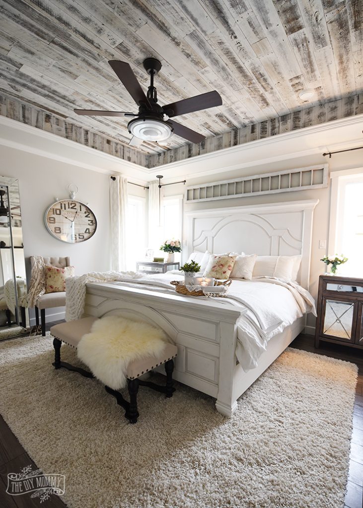 rustic farmhouse bedroom with barn wood ceiling