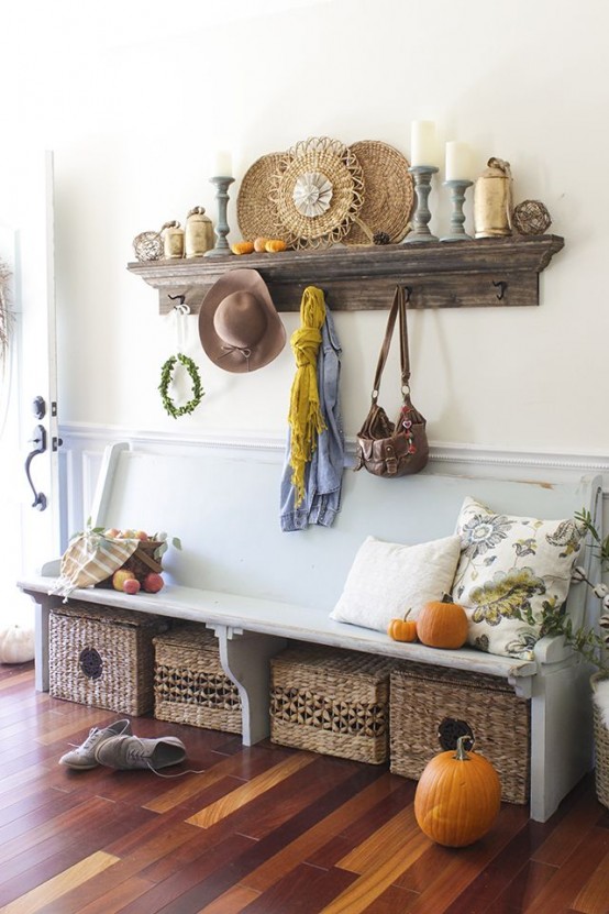  cozy fall farmhouse entryway with a shabby chic bench, a stained open shelf, basket boxes for storage and candles