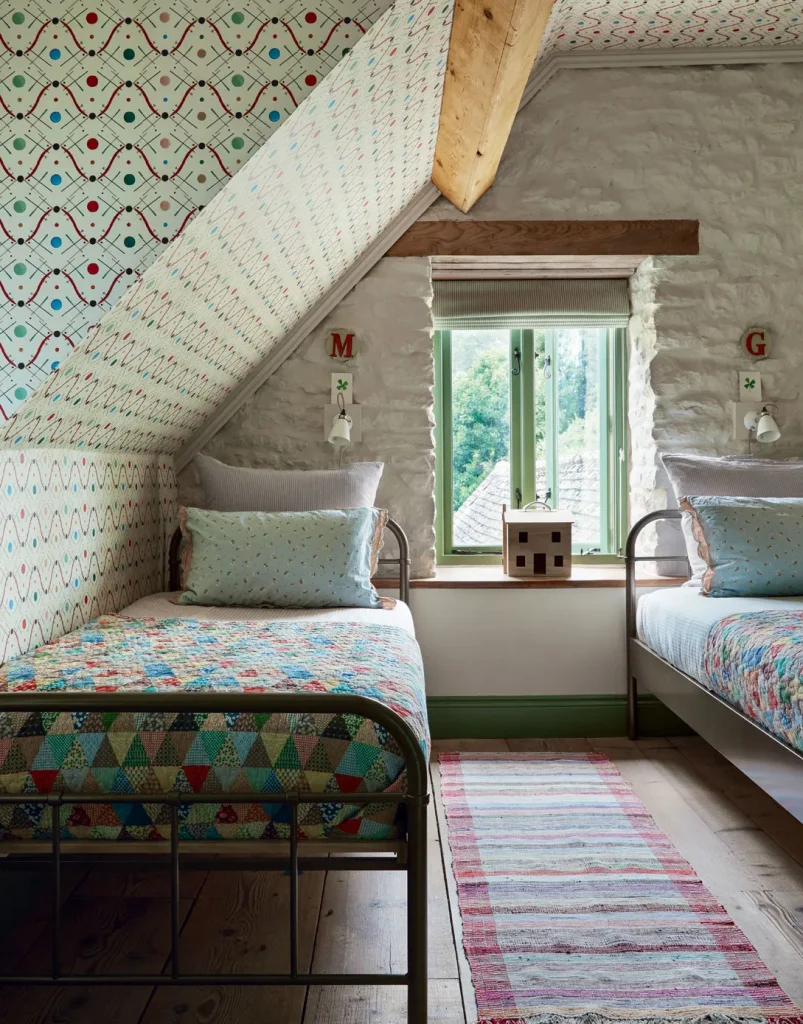 Vintage farmhouse shared bedroom with homemade quilts